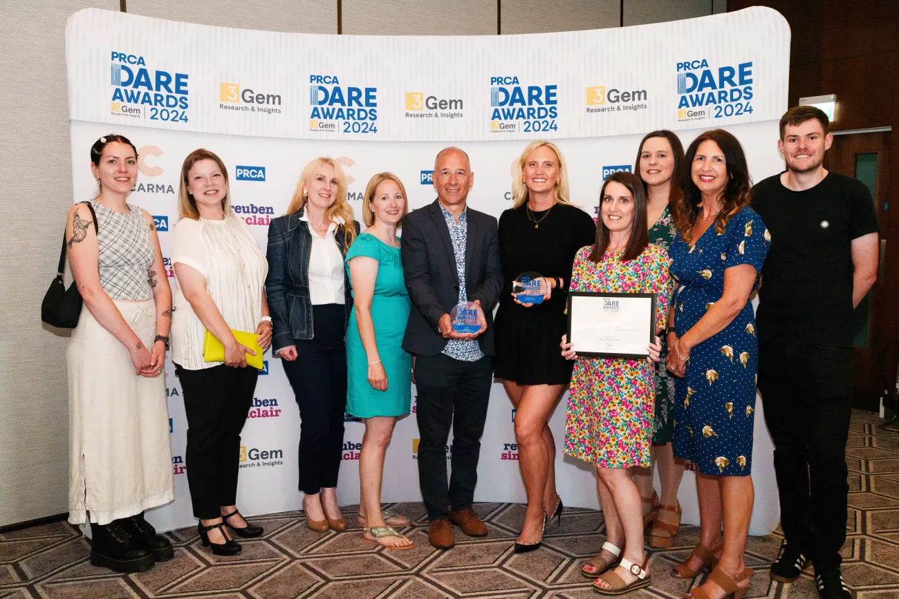 Image of the Four team standing with their awards 